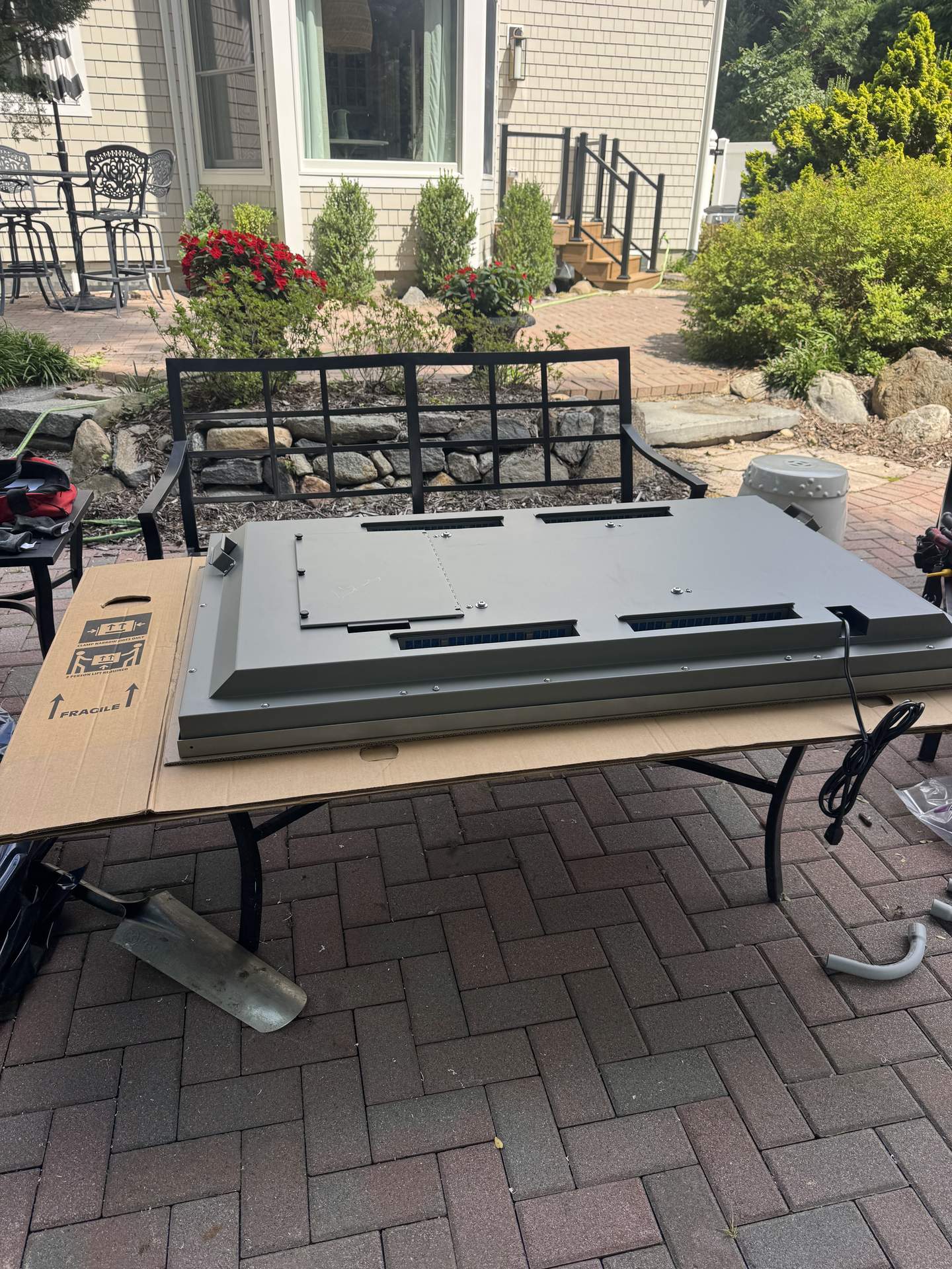 Weatherproof outdoor TV mounting hardware staged for installation in Northport, NY